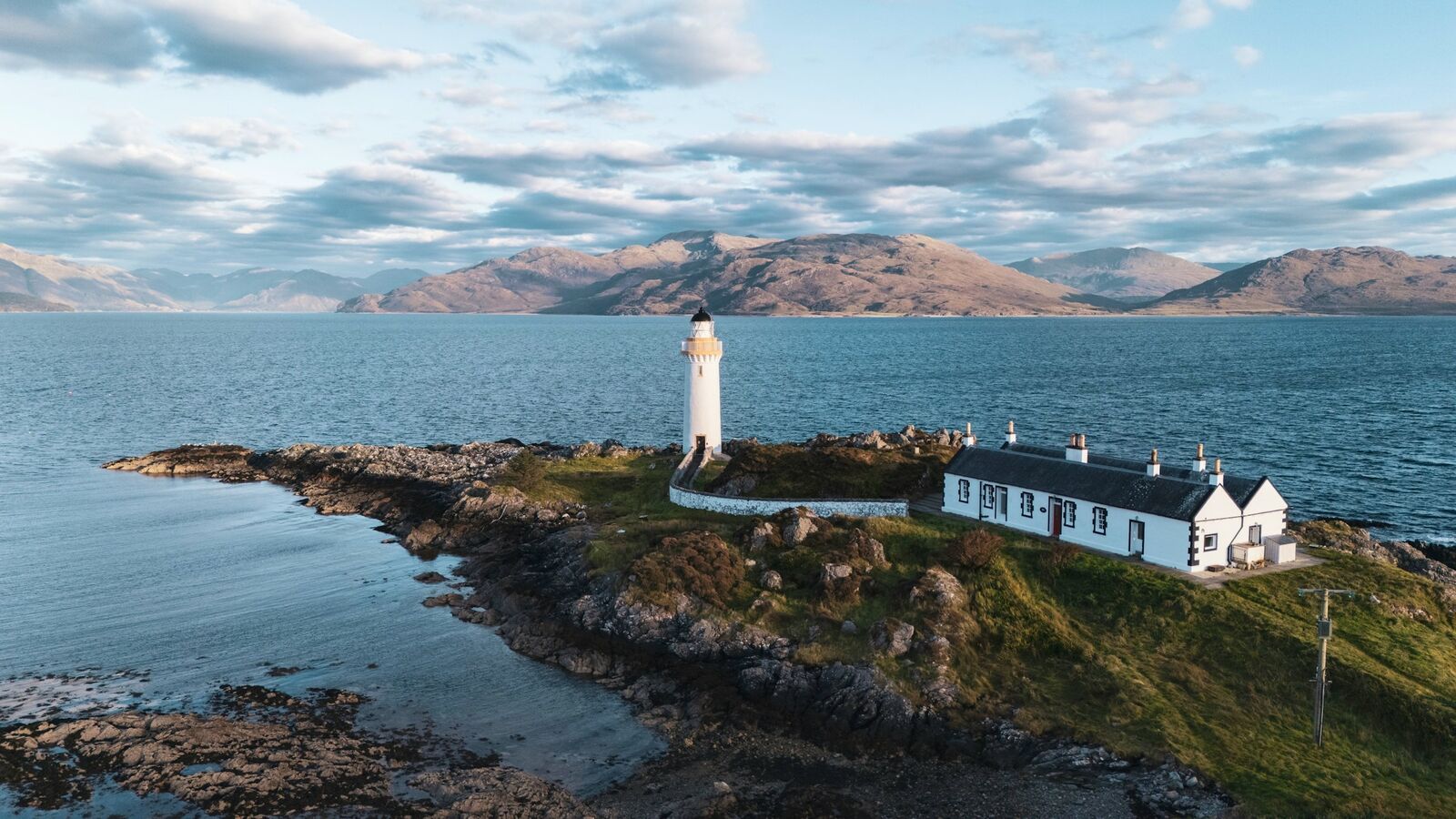 Eilean Sionnach lighthouse cottage on its own tidal island off the Isle of Skye